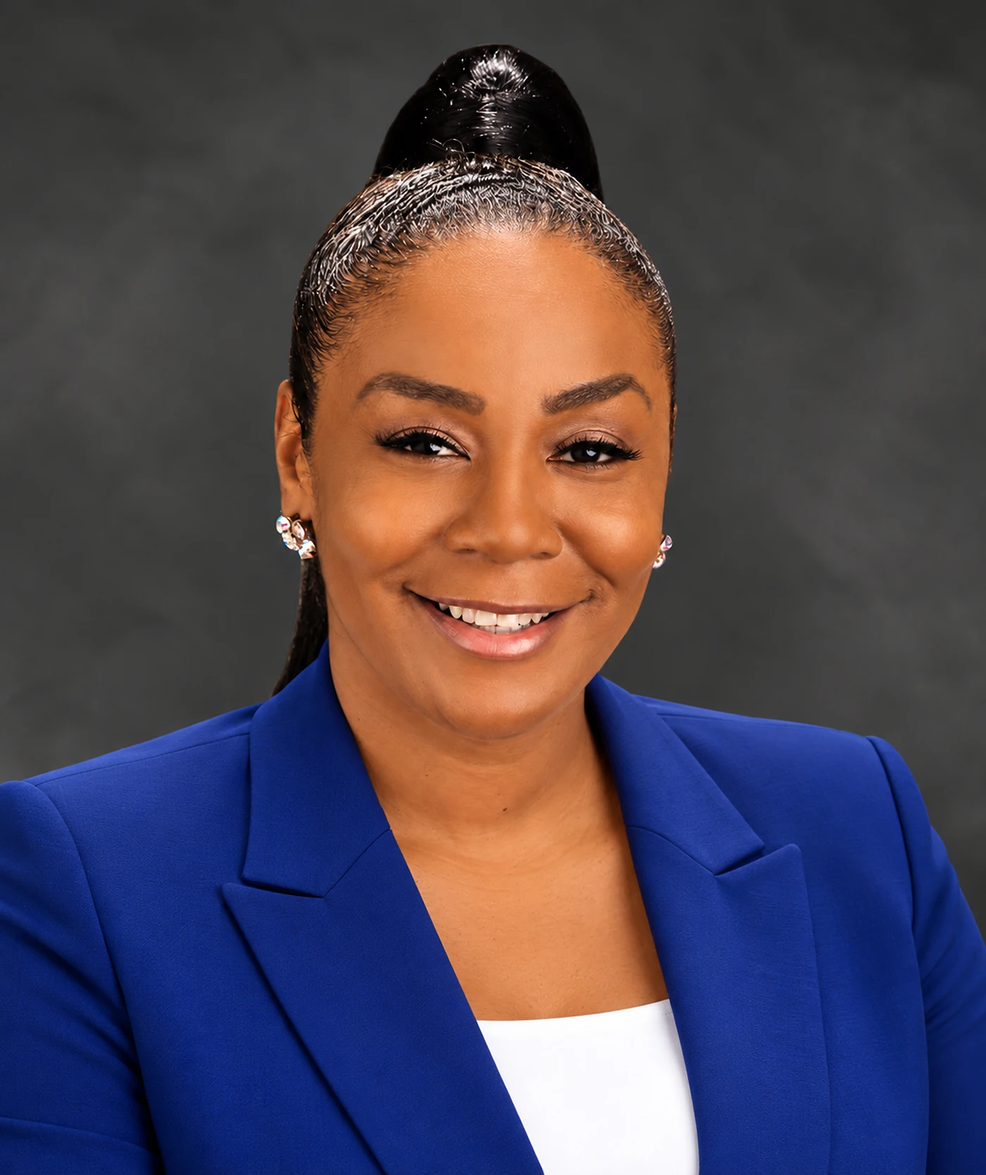 Kennetha Stevens smiling in a professional royal-blue suit